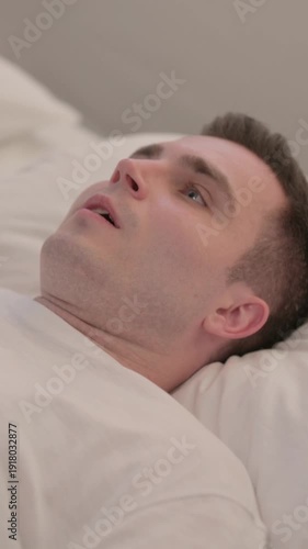 Shocked Young Man Waking Up in Despair after Nightmare, Vertical Video