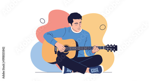 A relaxed young man sits cross-legged on the floor, peacefully playing an acoustic guitar against a backdrop of colorful abstract shapes.