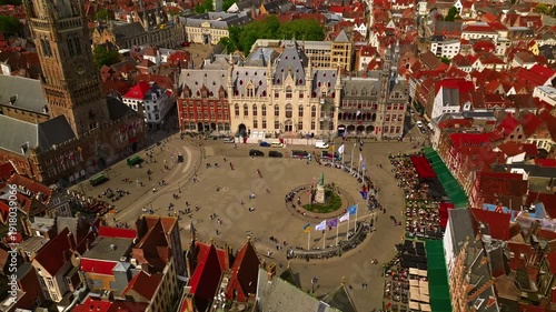 Aerial view of Bruges with historic Markt square and the Belfry Tower surrounder a sunny day