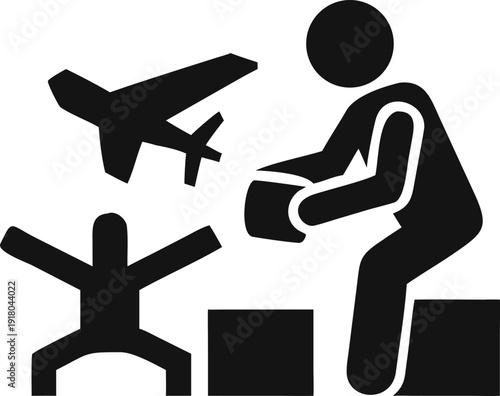 An adult gives a toy airplane to a small child playing with a box