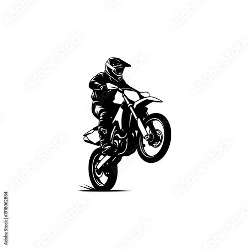 Motorcyclist performing a stunt on a dirt bike.