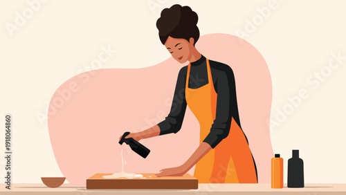 A person wearing an apron is pouring liquid from a bottle onto a wooden cutting board