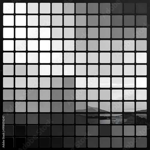 Abstract grayscale landscape. Shades blend in a square grid, revealing a mountain range and body of water below