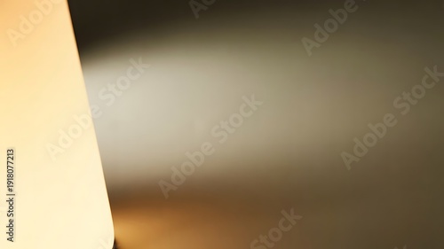 Abstract Light and Shadow Play on Textured Surface, Warm Glow Contrasting Cool Tones