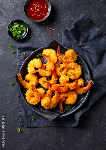 Tableau sur toile Shrimp in crunchy panko crust, spicy dipping sauce, minimalist food styling, gourmet seafood presentation