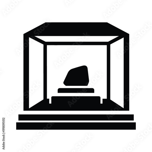 Modern museum display case with black stone on white background