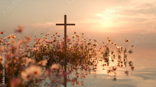 A tranquil sunrise bathes the scene in warm light, highlighting a wooden cross surrounded by flowers and calm water.