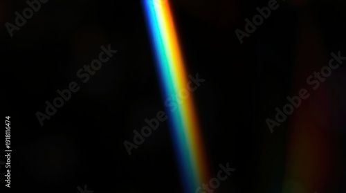 Blurred rainbow refraction overlay effect. Light lens prism effect on black background. Holographic reflection, crystal flare leak shadow overlay. Colorful rainbow disco ball light