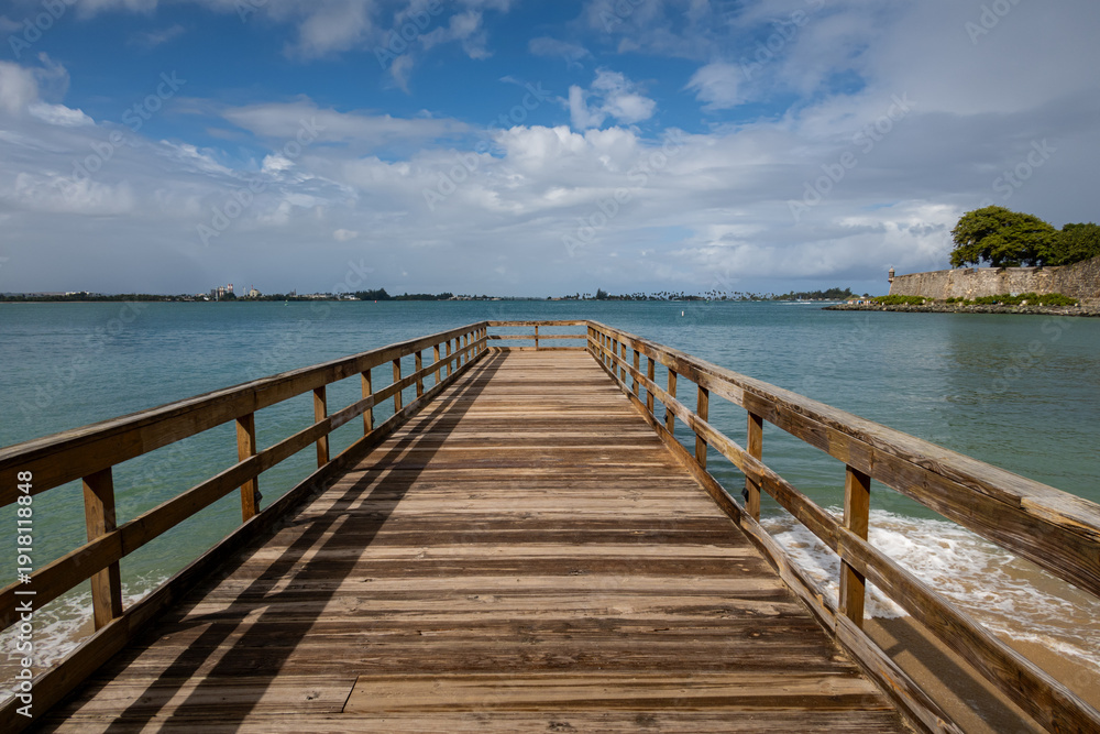 Fototapeta premium Wooden pier in San Juan Bay, Puerto Rico a Caribbean island, USA