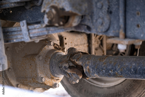 Canvastavla Close up of driveshaft universal joint and rear axle differential under heavy duty vehicle chassis