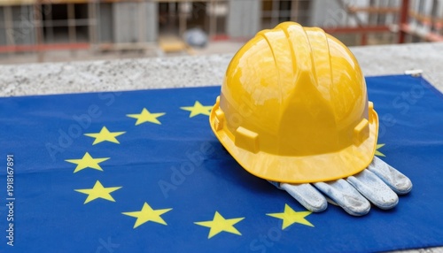 Construction safety measures european union compliance hard hat on flag industrial setting close-up view safety awareness