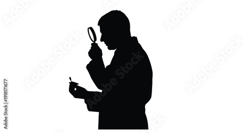 Silhouette of a man inspecting a small object with a magnifying glass