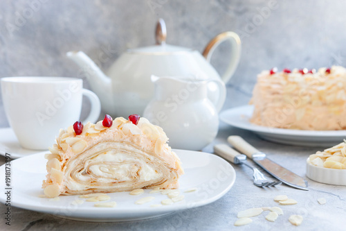 Trendy Shrovetide roll of thin pancakes with cream
