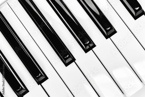 Close-up of piano keys showing black and white keys during a music lesson or practice session in a home