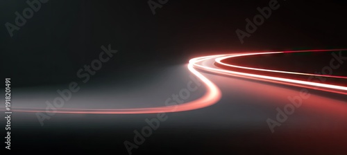Curved light trails against a dark background, suggestive of speed and motion