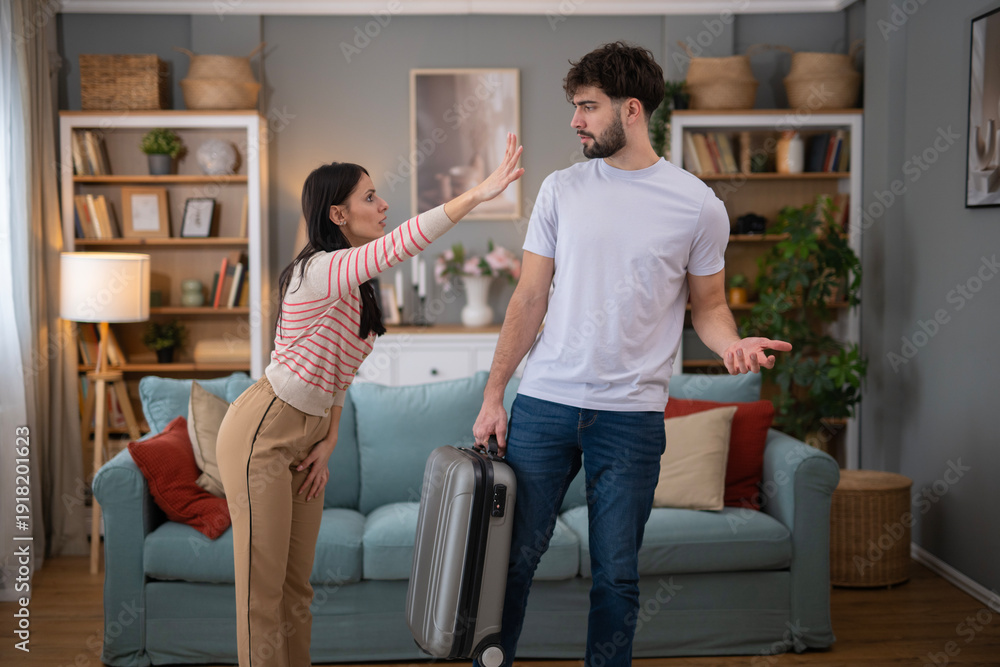 Naklejka premium Couple having relationship problems, man leaving home