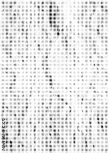 Halftone dot textured close up crumpled white paper with visible creases high contrast black dots seamless background abstract minimal surface design grainy vintage print effect studio