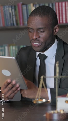 Wallpaper Mural African American Lawyer Doing Video Chat on Tablet in Office, Vertical Video Torontodigital.ca