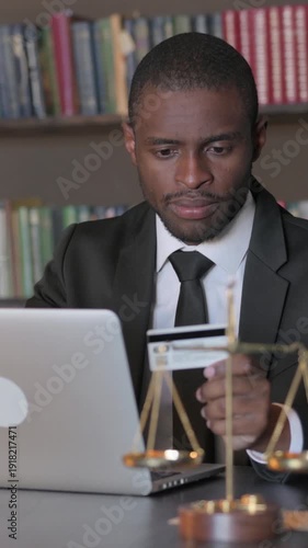 Wallpaper Mural African American Lawyer Doing Online Shopping on Laptop, Vertical Video Torontodigital.ca