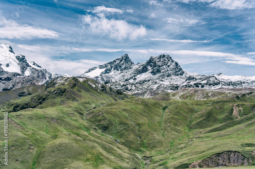 Wallpaper Mural A dramatic view of snow-covered peaks and rugged mountain terrain in the Peruvian Andes, captured from the hiking path to Rainbow Mountain. Torontodigital.ca