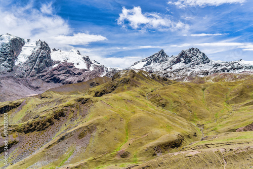 Wallpaper Mural A dramatic view of snow-covered peaks and rugged mountain terrain in the Peruvian Andes, captured from the hiking path to Rainbow Mountain. Torontodigital.ca