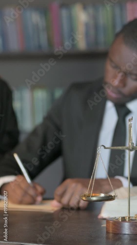 Wallpaper Mural Male and Female Lawyers Working on Documents, Scale of Justice in Focus, Vertical Video Torontodigital.ca
