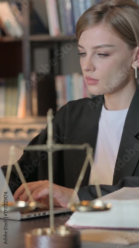 Wallpaper Mural Female Lawyer Working on Laptop, Vertical Video Torontodigital.ca