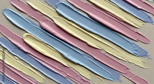 Diagonal stripes of thick, glossy paint in pink, blue, and gold create an abstract textured background pattern.