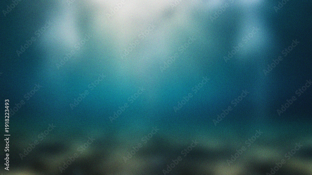 Obraz premium Underwater Sunlight Rays Shining Through Deep Blue Ocean Water