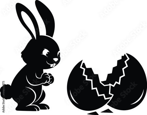 Cute bunny emerges from cracked eggshell in black silhouette