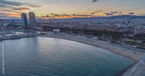 Barcelona aerial timelapse at sunset with beach marina and skyline