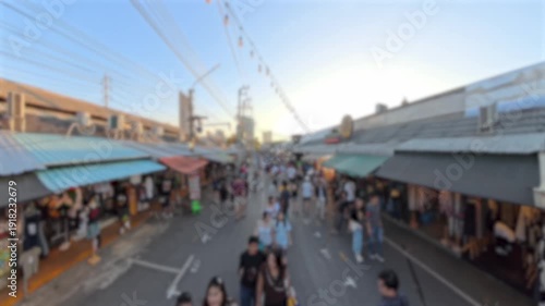 BANGKOK, THAILAND - NOV 2025 : Blurred view of Chatuchak Weekend Market. Largest market in Thailand. Travel and tourism concept video.