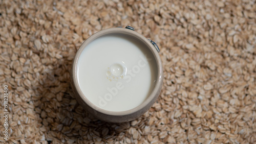 Oat Milk in Mug on Oat Flakes, Vegan Lactose Free Breakfast