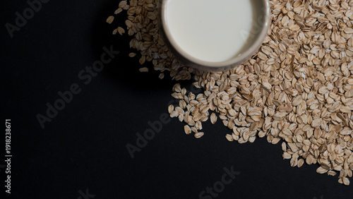 Oat Milk in Mug on Oat Flakes, Vegan Lactose Free Breakfast