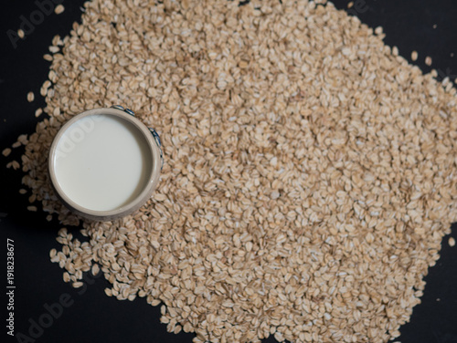 Oat Milk in Mug on Oat Flakes, Vegan Lactose Free Breakfast