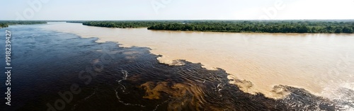 Aerial View: Confluence of Two Rivers with Contrasting Colors