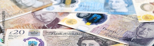 Wallpaper Mural British pound money bills pile on table. United Kingdom banknotes of GBP currency close up. Torontodigital.ca