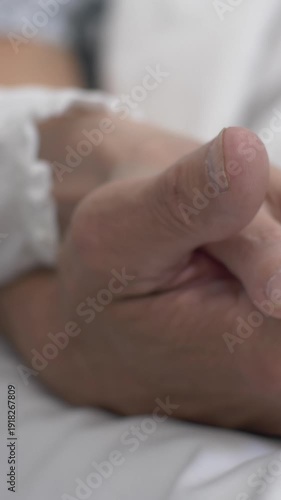 Woman holding mans hand hospital bed patient romance relationship support