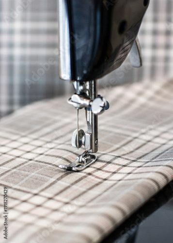 Foto Close up of a sewing machine stitching on a piece of fabric