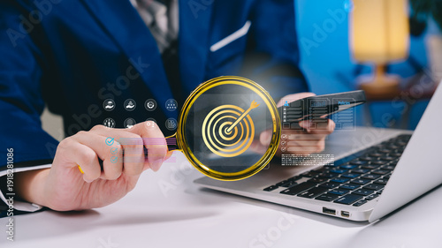 Businessman holding target icon with digital dashboard, goal achievement strategy, KPI performance measurement, success planning roadmap, business growth objective, strategic management concept