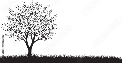 Black silhouette of a flowering tree with grass against a white background, representing nature and growth.