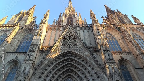 Barcelona, Spain - 12.14.2025 - Upward perspective revealing the intricate gothic architecture of Barcelona Cathedral in warm light