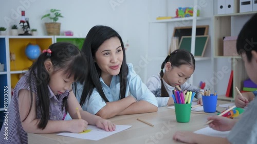 Wallpaper Mural Educational concept of 4k Resolution. The teacher is teaching the kindergarten children to draw in a fun way in the classroom. Torontodigital.ca