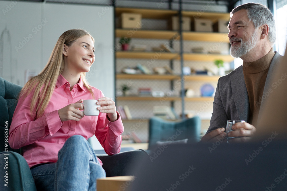 © opolja - Friendly colleagues having good relationships, conversation at workplace during coffee break