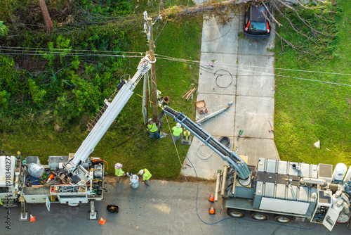 Konstfotografi Electrician workers fixing power lines after outage