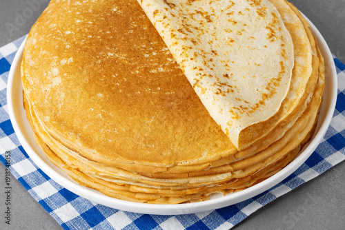 Freshly cooked pancakes on a grey table
