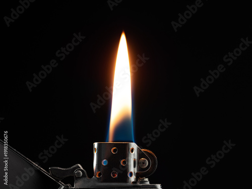 Cuadro en lienzo Glowing flame on gasoline lighter on black background
