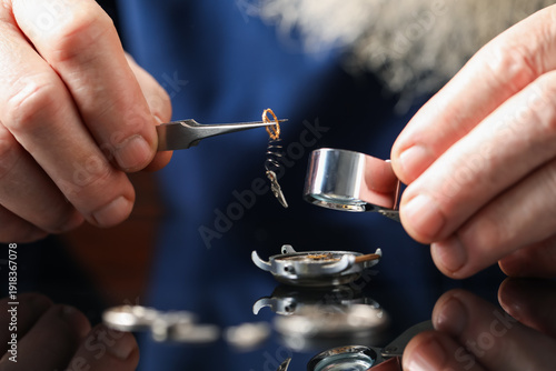 Εκτύπωση καμβά Senior man fixing mechanism of vintage wrist watch at mirror table, closeup