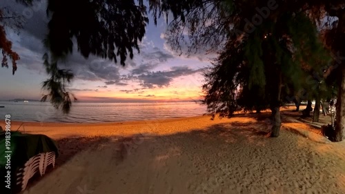 PATTAYA, THAILAND - NOVEMBER 2025 : View of Jomtien beach and beautiful sunset sky. Travel and tourism concept video.