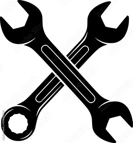 Crossed wrenches symbolizing repair tools for mechanics and handymen in a workshop setting

